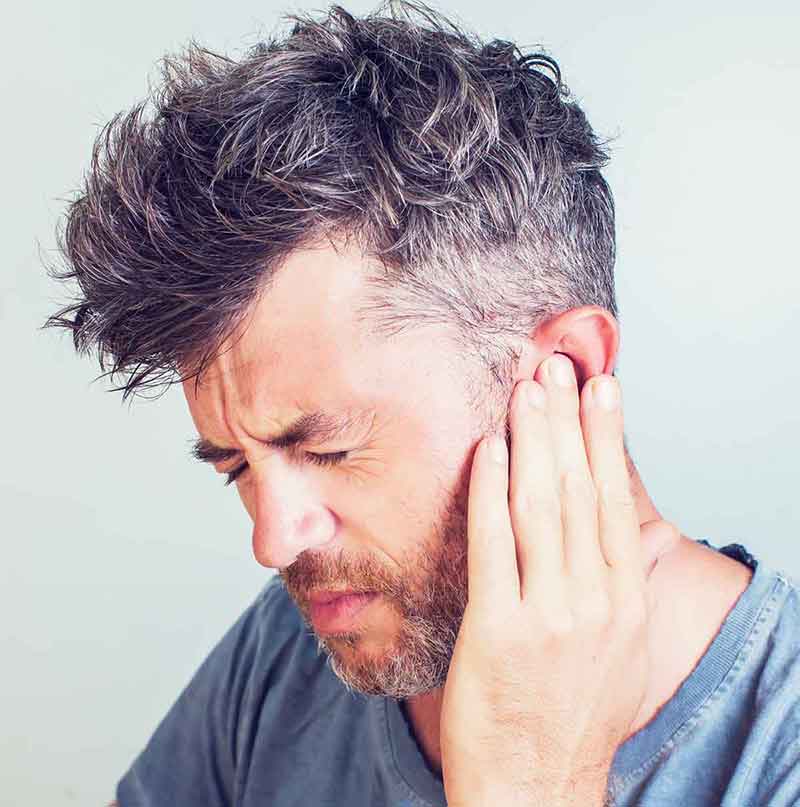 Man with ringing in his ear